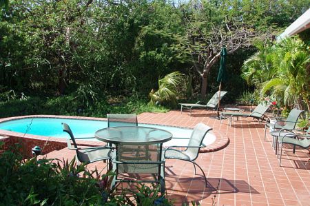 pool and chairs on villa patio